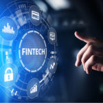 undervalued fintech stocks A concept image of a hand reaching toward the word "Fintech," which is surrounded by icons representing money and growth. Fintech Stock Bargains, fintech stock